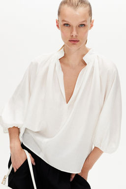 Blusa con mangas globo