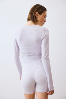 Top de deporte cruzado en modal - H&m фото 17