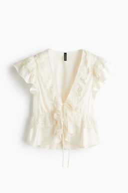 Blusa de sat?n con volantes
