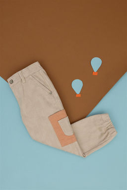 Кремовые джинсовые брюки для мальчика