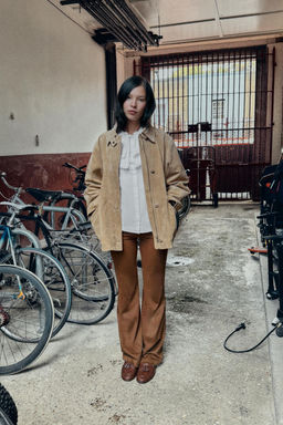 FAUX LEATHER FLARE TROUSERS