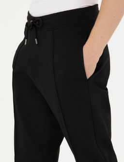 Черные новые спортивные штаны узкого кроя - Cacharel фото 6