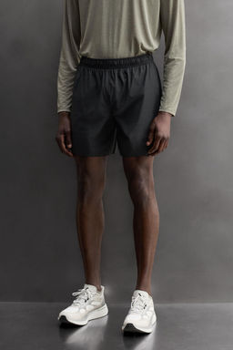 PANTALONES CORTOS RUNNING 2 EN 1 / Verde gris