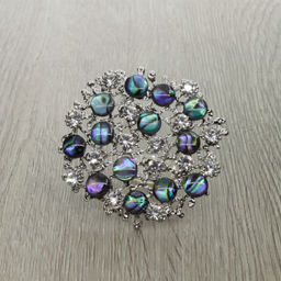 Брошь-подвеска "Калейдоскоп" со вставками из гелиотиса и ювелирного сплава