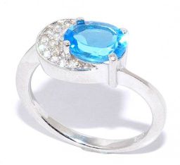 Кольцо с топазом "swiss blue"и куб.цирконием