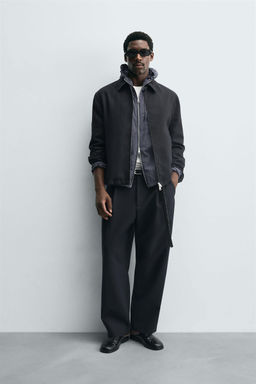 RELAXED FIT PLEATED TROUSERS