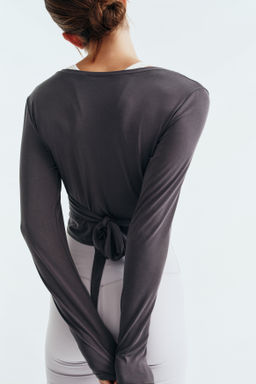 Top de yoga cropped con nudo decorativo SoftMove - H&m фото 7