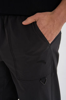 Брюки текстильные Черный ANTA OUTDOOR Woven Track Pants фото 7