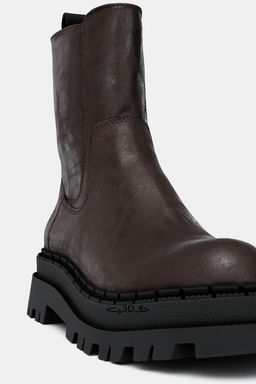 DISTRESSED-EFFECT PLATFORM ANKLE BOOTS