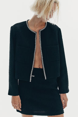 Chaqueta de boucle con strass