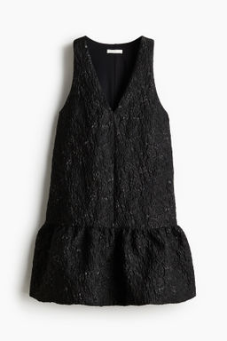 Vestido en tejido jacquard con bajo burbuja