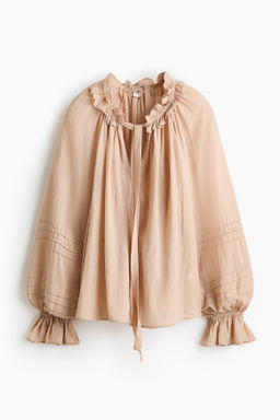 Blusa con cuello de volantes