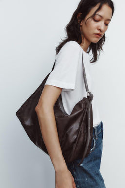 SOFT MAXI BUCKET BAG WITH METAL EYELETS