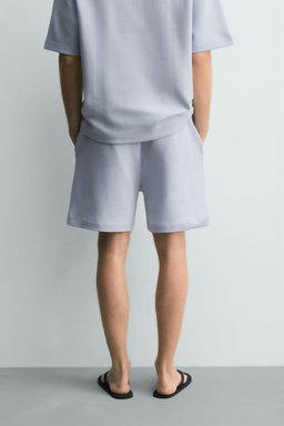 BERMUDA JOGGER RELAXED FIT INTERLOCK / Celeste