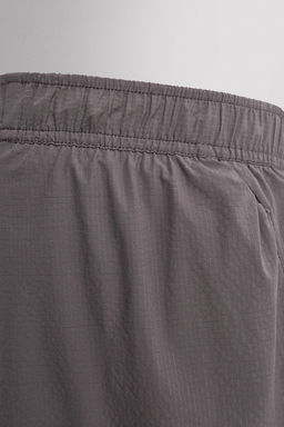 PANTALONES CORTOS LIGEROS RUNNING 3" / Morado