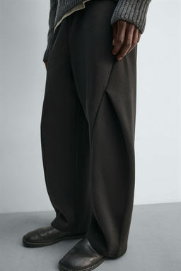 NEOPRENE-EFFECT PLEATED BALLOON FIT TROUSERS