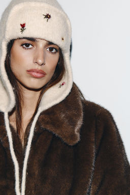 EMBROIDERED KNIT HAT WITH EARMUFFS