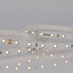 ULS-2835-60LED/m-8mm-IP20-DC24V-6W/m-5M-WW Гибкая светодиодная лента на самоклеящейся основе. Катушка 5 м. в герметичной упаковке. Теплый белый свет (3000K). ТМ Uniel.