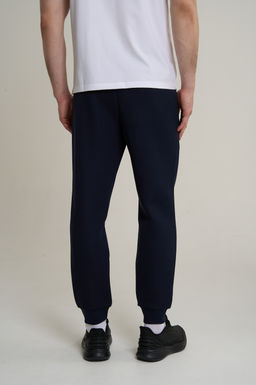 Брюки трикотажные Темно-синий TRN ESSENTIAL Knit Track Pants - Anta фото 6