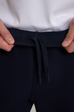 Брюки трикотажные Темно-синий TRN ESSENTIAL Knit Track Pants - Anta фото 9