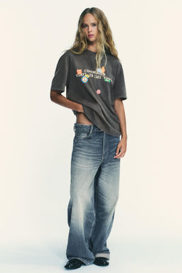 WASHED-EFFECT T-SHIRT WITH PRINTED PATCHES