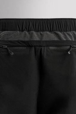 TECHNICAL TROUSERS WITH BELT