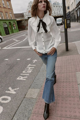 RUFFLED BLOUSE WITH CONTRAST BOW