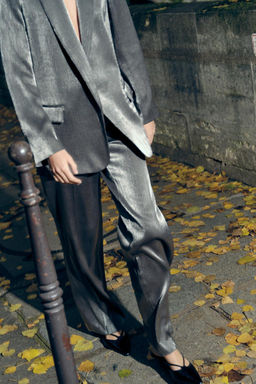 CREASED-EFFECT SHIMMERY TROUSERS