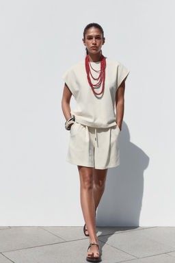 RUSTIC PLEATED BERMUDA SHORTS