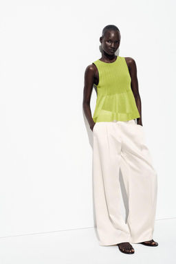 KNITTED TOP WITH RUFFLED HEM
