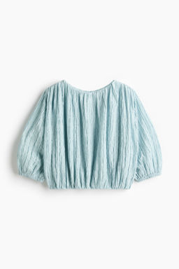 Blusa texturizada con bajo burbuja