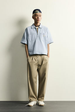 CAMISA POLO CREMALLERA BOLSILLOS / Azul claro