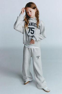 WIDE-LEG TROUSERS WITH SLOGAN