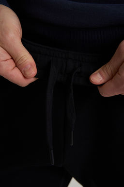 Брюки трикотажные Черный TRN ESSENTIAL Knit Track Pants - Anta фото 6