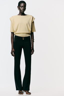 KNIT TOP WITH SHOULDER PADS