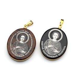 Кулон из обсидиана овал с окантовкой " Пантелеймон" 20*30мм.