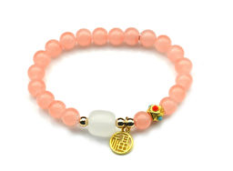 Браслет На удачу с подвеской шарик 8мм цв.персиковый, 17см