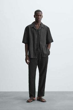 RELAXED FIT TEXTURED TROUSERS