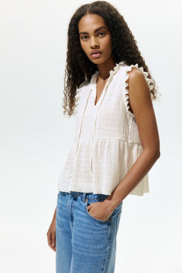 Top con ribetes de volante y lazada - H&m фото 7