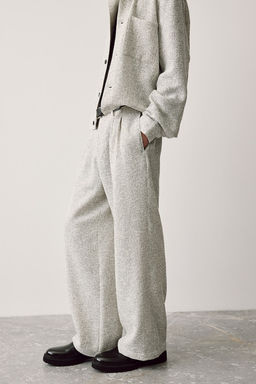 Pantalon brillante con textura Relaxed Fit - H&m фото 5