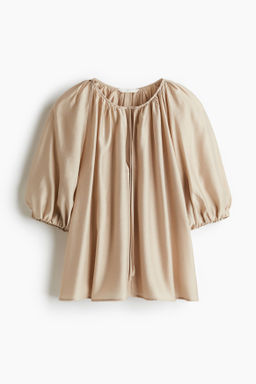 Blusa con mangas globo