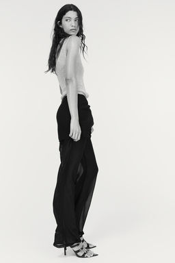 Pantalon de gasa con falda superpuesta
