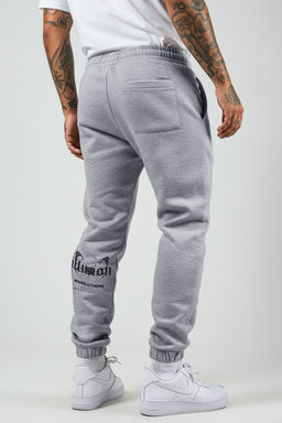 TRENDYOL MAN Gri Melanj Oversize/Genis Kesim Lastik Paca Kelebek Bask?l? Esofman Alt? TMNSS25EA00006