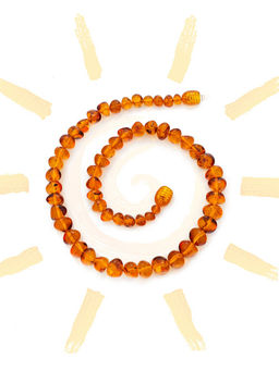 Нарядные детские бусы из коньячного янтаря Галька глянцевая