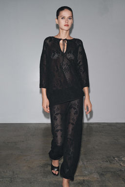 FLORAL STRUCTURE KNIT TROUSERS