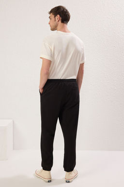 TRENDYOL MAN Siyah Oversize/Genis Kesim Lastik Paca Gulen Yuz Bask?l? Jogger Esofman Alt? TMNSS22EA0119 - Trendyolmilla фото 4