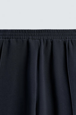 FLOWING TROUSERS WITH ZIPS