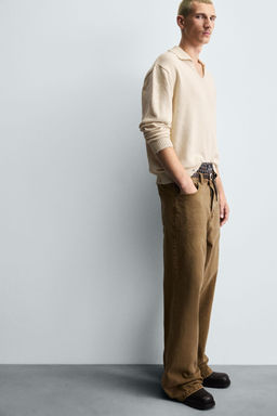 KNITTED RIPPED-EFFECT POLO SHIRT