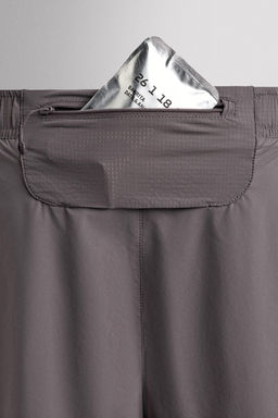 PANTALONES CORTOS RUNNING 2 EN 1 / Morado
