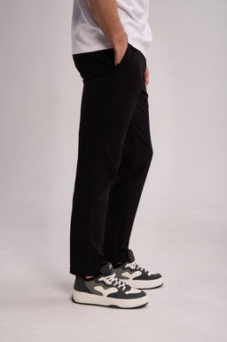 Брюки текстильные Черный TRN Woven Track Pants - Anta фото 3